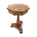 A Victorian marquetry inlaid sewing table, the octagonal top with specimen woods and the underside