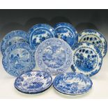 Eleven Cambrian pottery dinner plates, various blue printed patterns and marks.Condition report: One