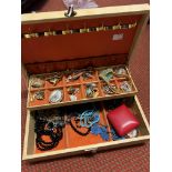 A box of costume jewellery.