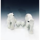 Two large Lomonosov USSR porcelain polar bears, tallest height 24cm and two polar bear cubs,