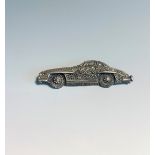 A stylish car brooch set with marcasite.