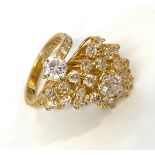A fabulous 18ct gold ring set with an explosion of clear bright white diamonds the largest being