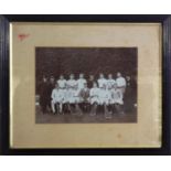 An early 20th century framed photograph of a cricket team, 23cm x 27.5cm, together with a similar