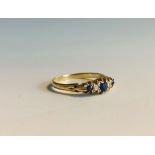 An 18ct gold Chester hallmarked Victorian style ring set with two diamonds and three