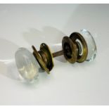 An early 20th century glass and brass door handle. Glass knobs 7cm x 4cm.Condition report: Chips and