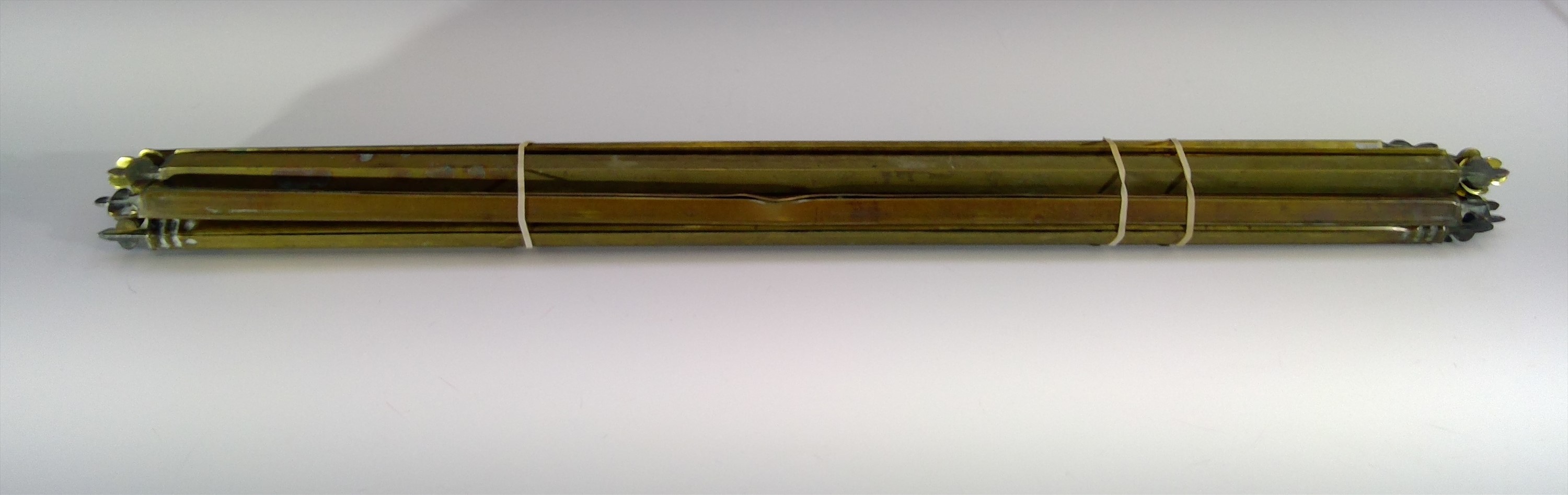A set of 14 brass stair rods. Width 68cm.Condition report: The bracket fittings are lacking.