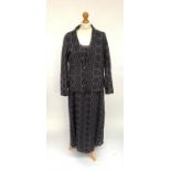 A matching dress, slip and jacket set in faded black embroidered cut-out cotton by Wrap of London, a