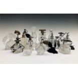 A collection of Art Deco period scent bottles and atomisers with black overlay decoration,