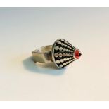 A Modernist silver cone ring set a red stone.Condition report: Maker not known Mark GFB See images