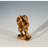 A Japanese carved wood netsuke, signed, height 5.5cm.