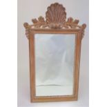 A pine rectangular wall mirror, 20th century, with shell and foliate cresting, height 126cm, width