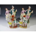 A pair of Victorian Staffordshire figure groups modelled as a young couple, and a pair of spill