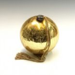 A Victorian gold glass witch ball. Height 23.5cm (excluding length of cord).