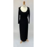 A black long sleeved floor length silk evening dress by Jasper Conran, with thigh length split to
