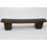 A late 19th/early 20th century African Zulu headrest, on two block feet. Wiidth 41cm .