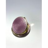 An Austrian silver gilt small compact with lilac guilloche enamel.Condition report: This good