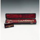 A cased Italian piccolo inscribed ' Ida Maria/ Grassi/Made in Italy' , and a cased miniature