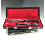 A Buisson student oboe, with original case, together with a Howarth case.Condition report: With