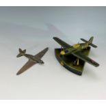 A carved and painted wood model of a Spitfire, with stand, together with a small copper aeroplane.