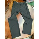 A pair of smart straight leg black wool trousers by Gucci, label size 46.