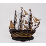 An early 20th century model of H M S Victory, modelled fully rigged and on a Victorian shaped