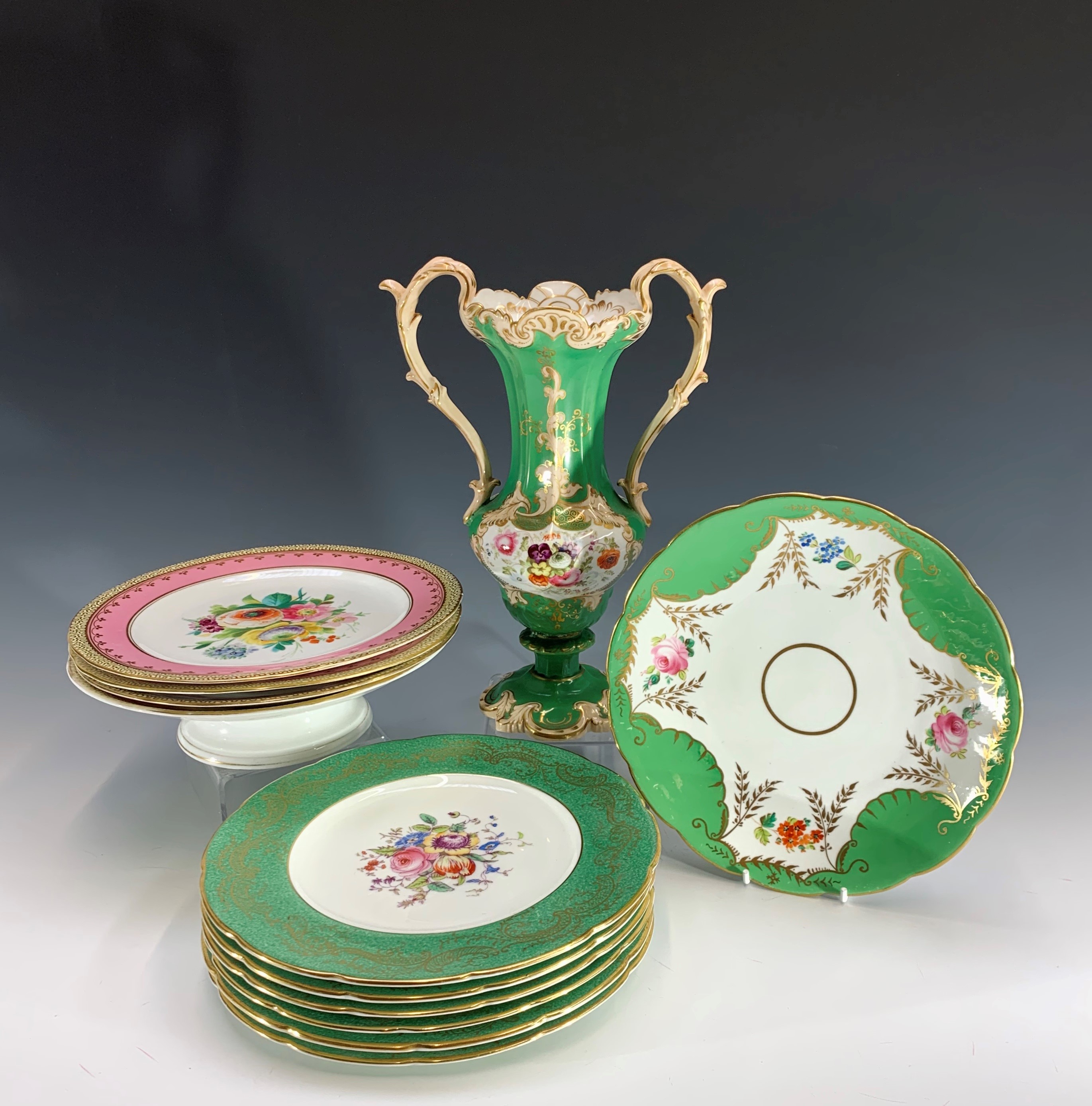 Six early 20th century Coalport plates retailed by T. Hayward & Co. of Manchester, each painted with