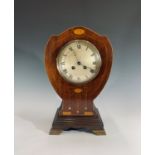 A mahogany Art Nouveau balloon clock, the case inlaid wit/h floral paterae and boxwood stringing