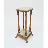 A Continental gilt and marble tier stand, early 20th Century, with foliate decorated column supports
