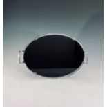 An Art Deco style black glass and chrome oval tray, possily O rrefors. Width 38cm.