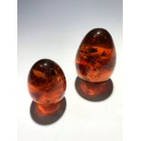 Two 'amber' style eggs 173gm