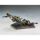 A bronzed figure group of rugby players, inscribed 'TL 5/12' to base. Height 17.5cm, width 37.5cm,