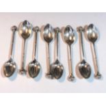 Eight silver golf spoons Eight silver golf spoons