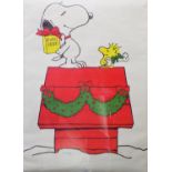 A Christmas themed Snoopy poster after Charles Schulz, 70cm x 50cm, together with a 'Disneyland