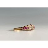An 18ct ruby and diamond set ring.