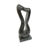 A freeform stone sculpture on rectangular base. Height 79.5cm.Condition report: See images for two