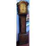 A George III eight day oak longcase clock, the rolling moon arched dial signed 'Wm Menadue,