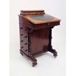 A Victorian inlaid walnut davenport, with four drawers opposed by four dummy drawers, height 86cm,