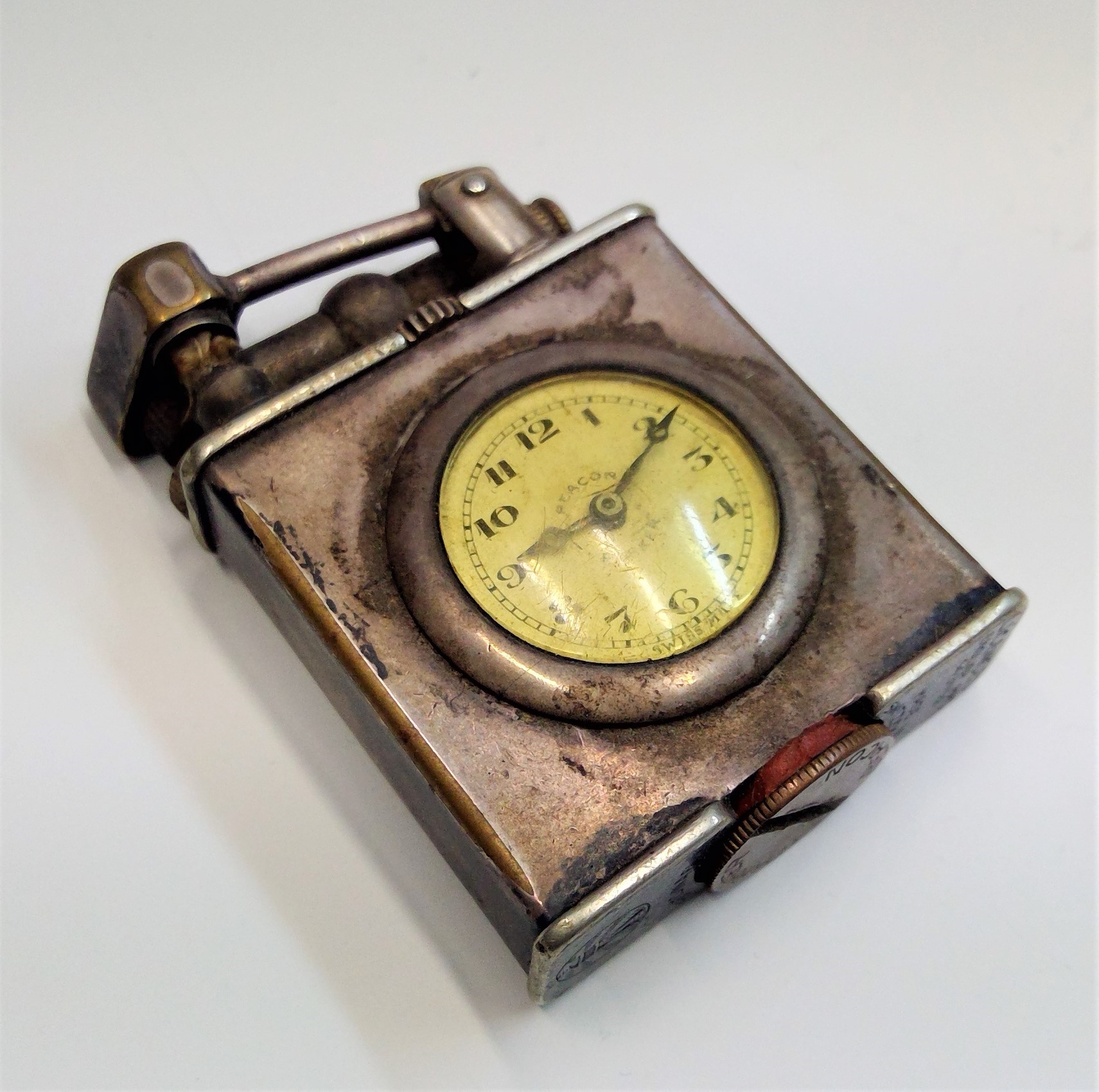A Parker Beacon Dunhill silver plated lighter/pocket watch maximum height 47mmCondition report: