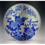 A Japanese blue and white charger, circa 1900, diameter 31cm.