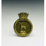 A brass ship's badge - HMS Chieftain. Height 23cm.