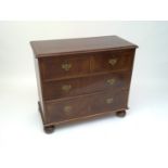 An 18th century style walnut chest of drawers, of small proportions, with two short and two long