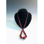 A 'cherry amber' necklace.Condition report: Length 78cm, stringing feels secure. All knots intact.