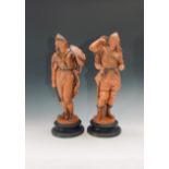 Two 19th century German earthenware figures of warriors, one depicted as reaching for an arrow