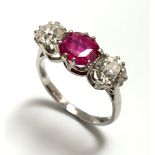 A fine platinum three stone diamond and pink sapphire ring.Condition report: Approx size L. Bright