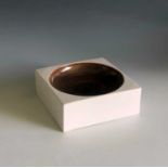 A Troika Pottery white and bronze glazed ash tray, signed 'Troika England' and with Avril Bennets