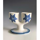 A white Troika pottery double egg cup with under glaze blue decoration, St Ives rubber stamp mark,