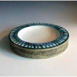 A Troika pottery round ashtray with blue under glaze decoration to the rim, signed 'Troika St