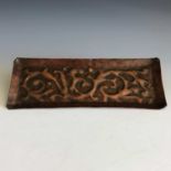 A Newlyn Industrial Class pin tray with repousse seaweed decoration 22 x 8.5cm