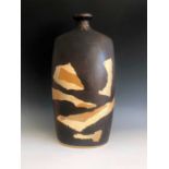 A Tremaen Pottery lamp base, height 42cm, with layers of abstract resist decoration.