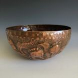 A Cornish art copper bowl, attributed to Reginald Dick, embossed with poppies and with a rope